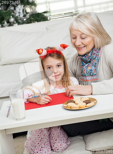 Image of Girl Making Christmas Greeting Card