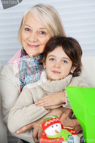 Image of Grandmother Embracing Boy During Christmas