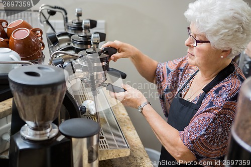 Image of Barista Preparing Coffee In cafe