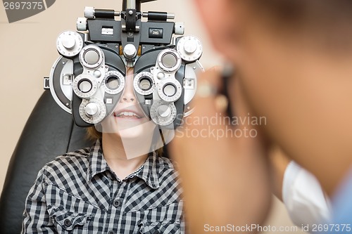 Image of Boy Undergoing Eye Test With Phoropter