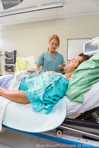 Image of Nurse with Patient in Emergency