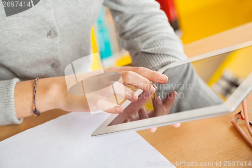 Image of Closeup Of Student Using Digital Tablet In Library