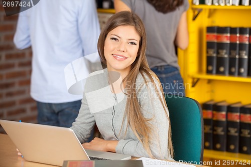 Image of Woman Sitting With Laptop In University Library