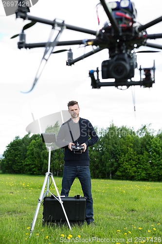 Image of Engineer Flying Photography Drone