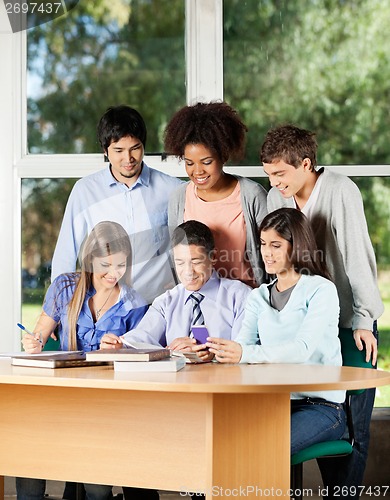 Image of Teacher Explaining Students In Classroom