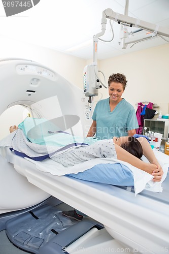 Image of Nurse Looking At Patient About To Undergo CT Scan