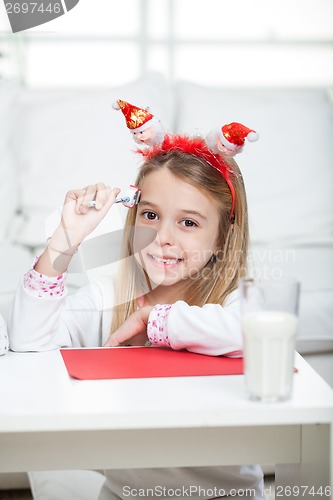 Image of Happy Girl With Pencil And Cardpaper