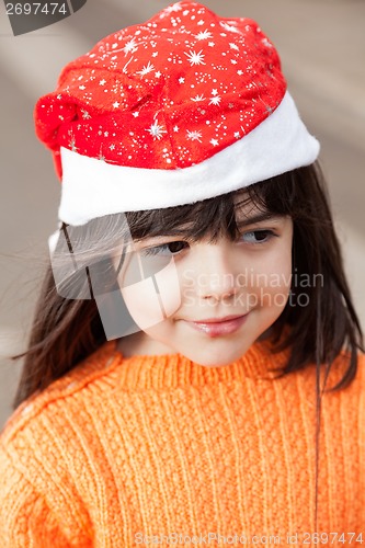 Image of Girl In Santa Hat Looking Away