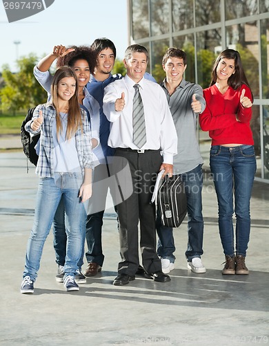 Image of Confident Students And Professor Gesturing Thumbsup On Campus