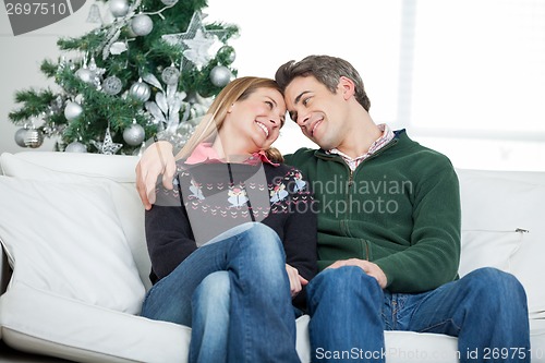 Image of Romantic Couple Looking At Each Other During Christmas