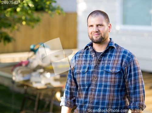 Image of Confident Manual Worker Standing At Construction Site