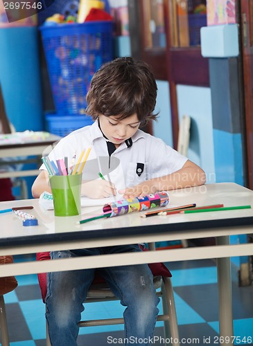 Image of Boy Drawing With Student Sitting In Background