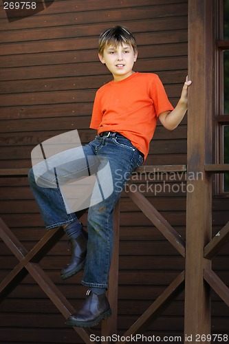 Image of Boy sitting on the verandah