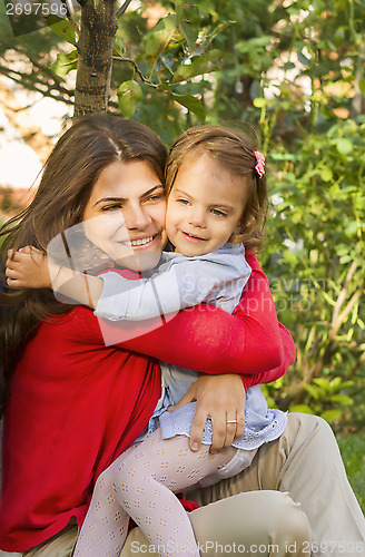 Image of Mother and daughter hugging