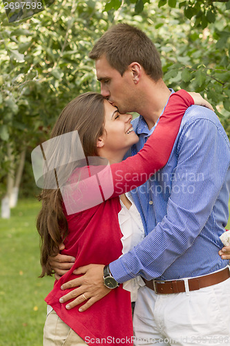 Image of Beautiful couple enjoying in the beautiful autumn day. 