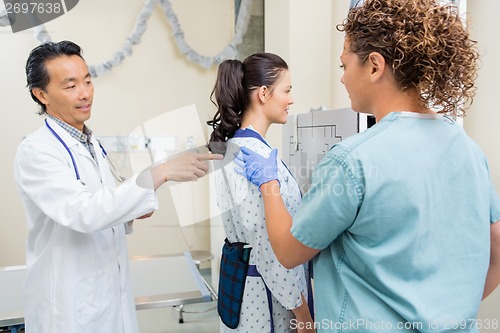 Image of Medical Team Preparing Patient For Chest Xray