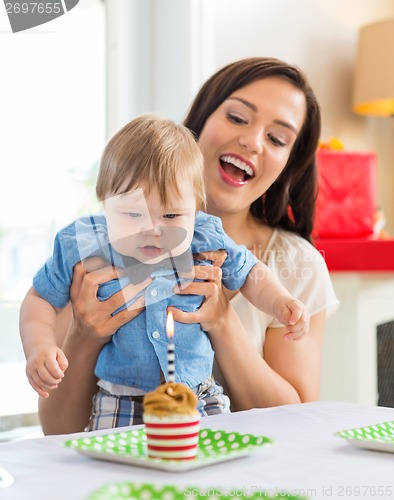 Image of Mother With Baby Boy Celebrating Birthday At Home