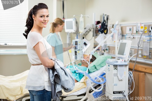 Image of Beautiful Woman With Nurse Examining Patient