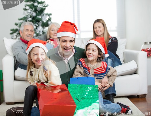 Image of Happy Family With Gifts During Christmas