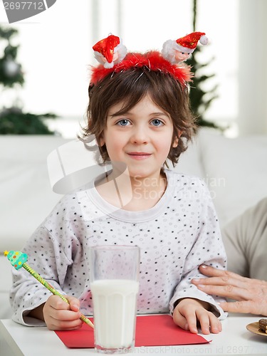 Image of Cute Boy Making Christmas Greeting Card