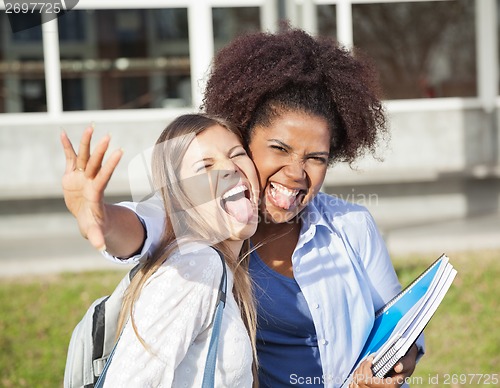 Image of Playful Student With Friend Making Facial Expressions On Campus