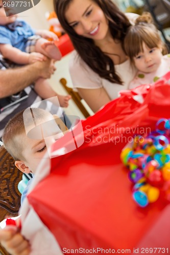 Image of Birthday Boy Opening Gift Box