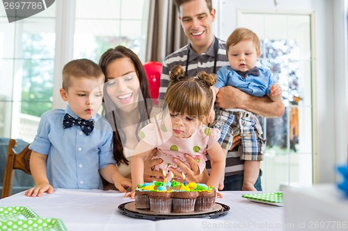 Image of Family Celebrating Girl's Birthday