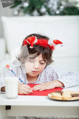 Image of Boy Writing Letter To Santa Claus