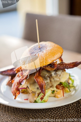 Image of Bacon Burger on Plate in Restaurant