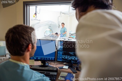 Image of Medical Team In CT Scan Lab