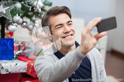 Image of Man Taking Self Portrait Through Smartphone