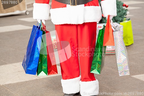 Image of Santa Claus Carrying Shopping Bags