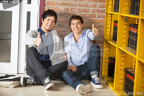 Image of Friends With Digital Tablet Gesturing Thumbsup Library