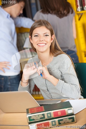 Image of Female Student With Laptop Sitting University In Library