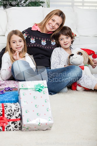 Image of Loving Mother With Children During Christmas