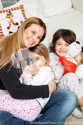 Image of Loving Mother With Children During Christmas