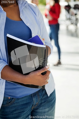 Image of Student With Book And Cellphone At University Campus