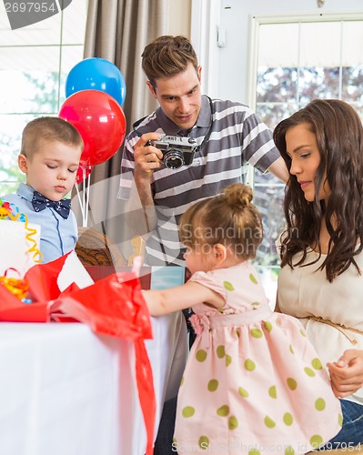 Image of Family Celebrating Girl's Birthday