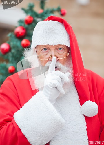 Image of Santa Claus With Finger On Lips