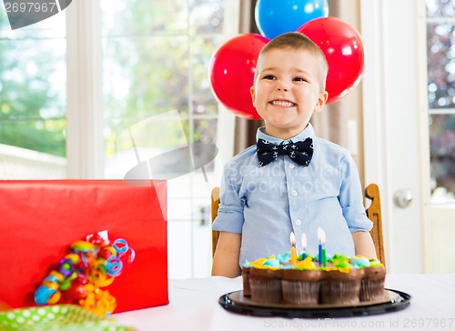 Image of Birthday Boy With Cake And Present On Table