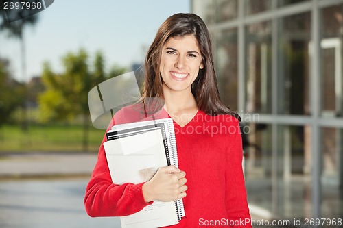 Image of Student With Books Standing On College Campus