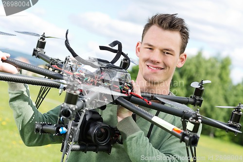 Image of Technician Holding UAV Octocopter