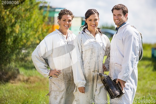 Image of Beekeepers Standing At Apiary