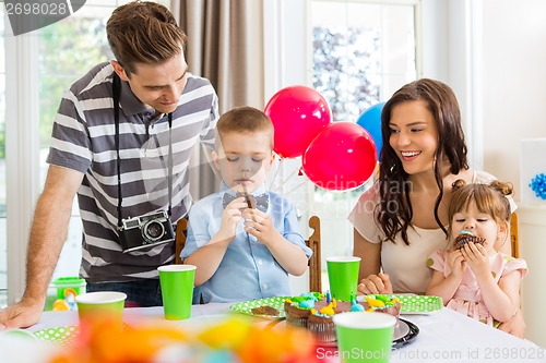 Image of Family Celebrating Birthday Party At Home