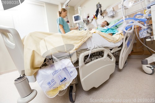 Image of Urine Bag Attached To Bed