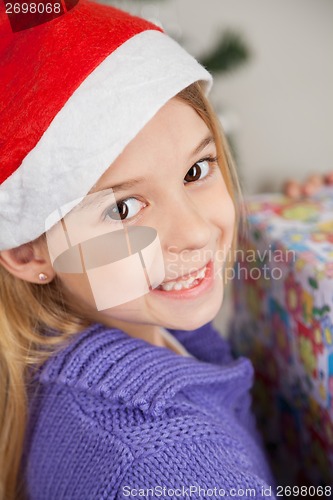 Image of Cute Girl With Christmas Present