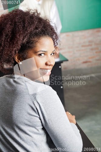 Image of Beautiful Woman Smiling In Classroom