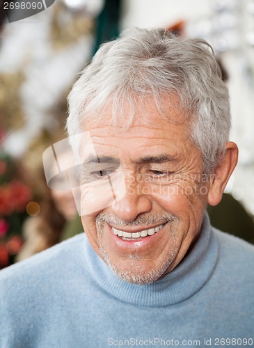 Image of Senior Man In Christmas Store