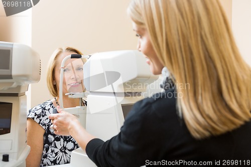 Image of Optometrist Using Tonometer to Measure Patients Eye Pressure