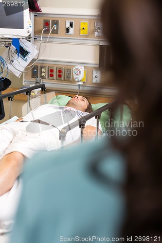 Image of Patient Lying On Bed In Hospital Emergency